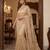 Beige embroidered net saree