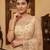 Beige embroidered net saree