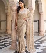Beige embroidered net saree