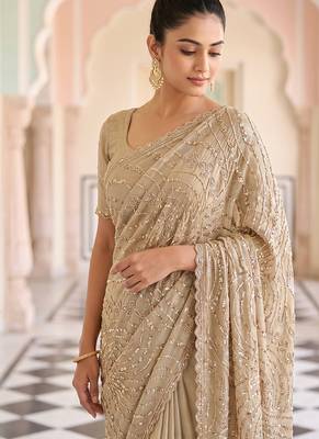 Beige embroidered net saree 3