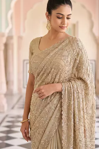 Beige embroidered net saree
