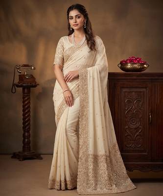 Cream embroidered soft foil georgette saree 1
