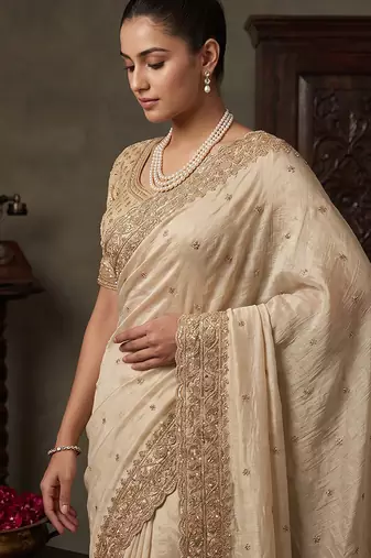 Cream embroidered soft foil georgette saree