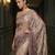 Beige embroidered georgette saree