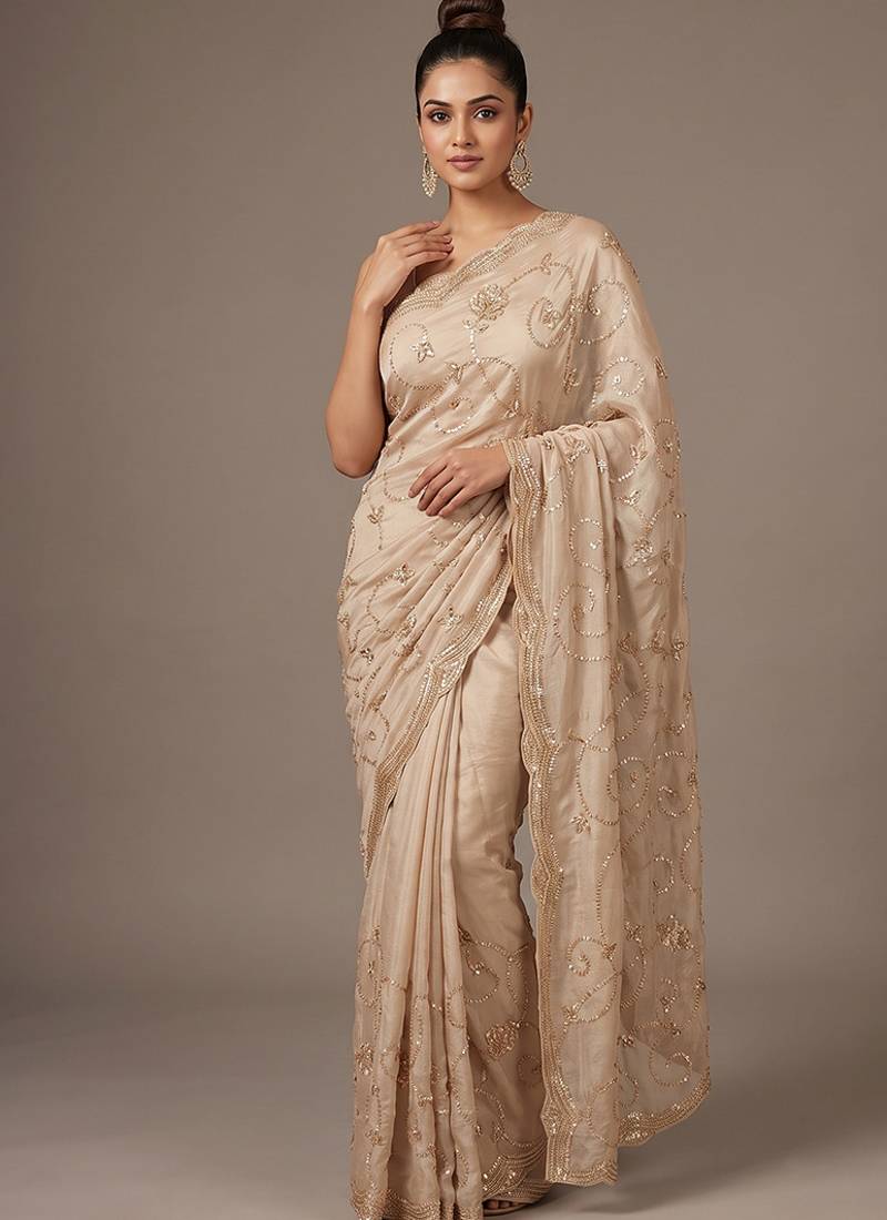 Cream embroidered georgette saree
