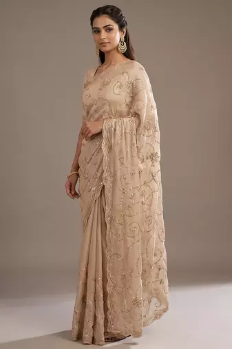 Cream embroidered georgette saree