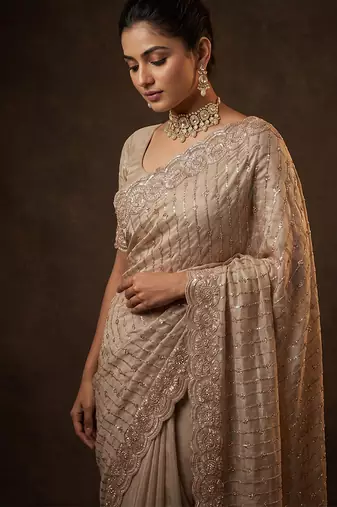 Champagne gold embroidered soft georgette saree