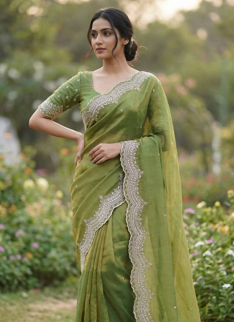olive color embroidery work with cut work border and havy daimond work silk blend saree