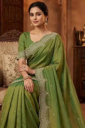 olive color embroidery work with cut work border and havy daimond work silk blend saree
