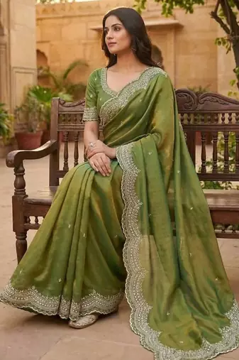 olive color embroidery work with cut work border and havy daimond work silk blend saree