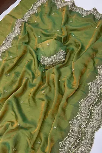 olive color embroidery work with cut work border and havy daimond work silk blend saree