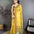 yellow color muga cotton blend woven with flower printed saree