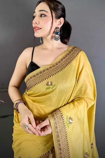 yellow color muga cotton blend woven with flower printed saree