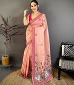 pink color muga cotton blend woven with flower printed saree