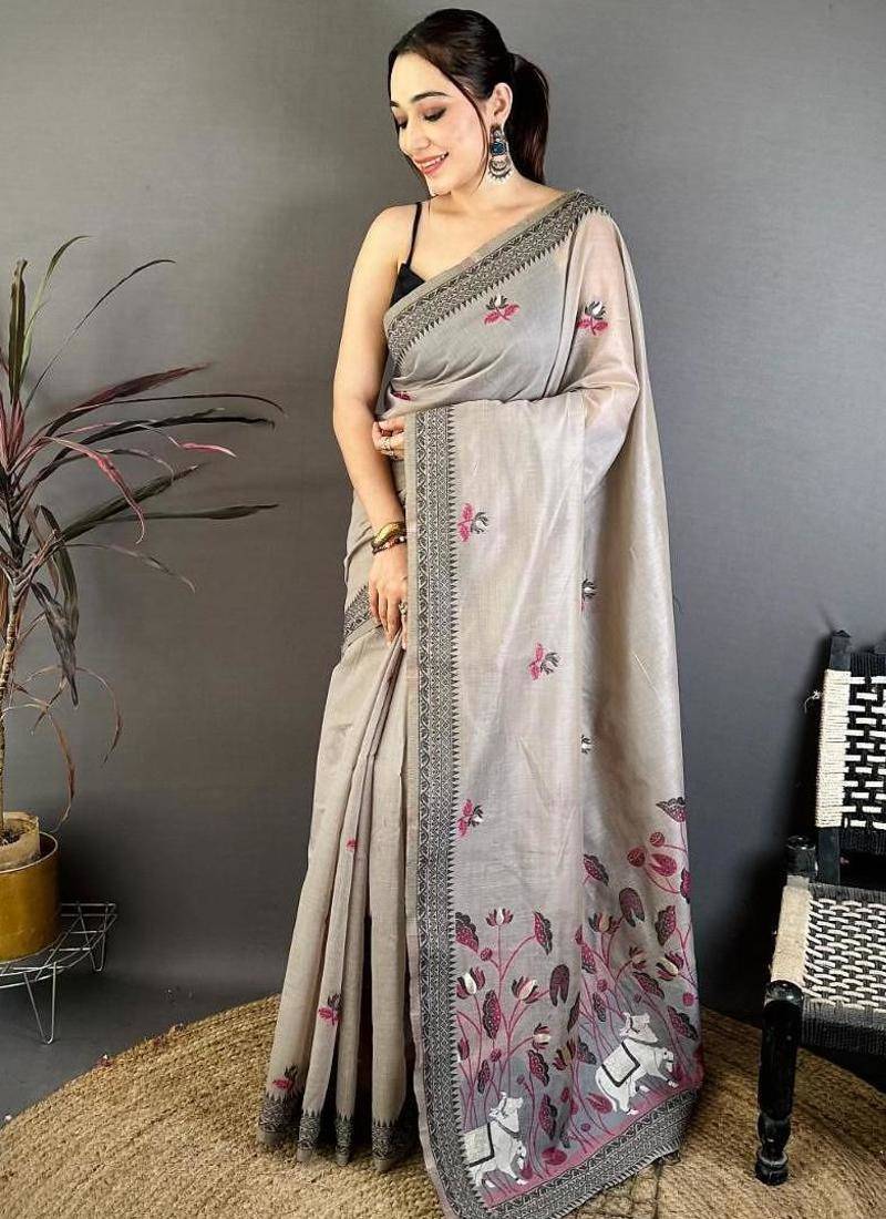 grey color muga cotton blend woven with flower printed saree