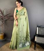 green color muga cotton blend woven with flower printed saree