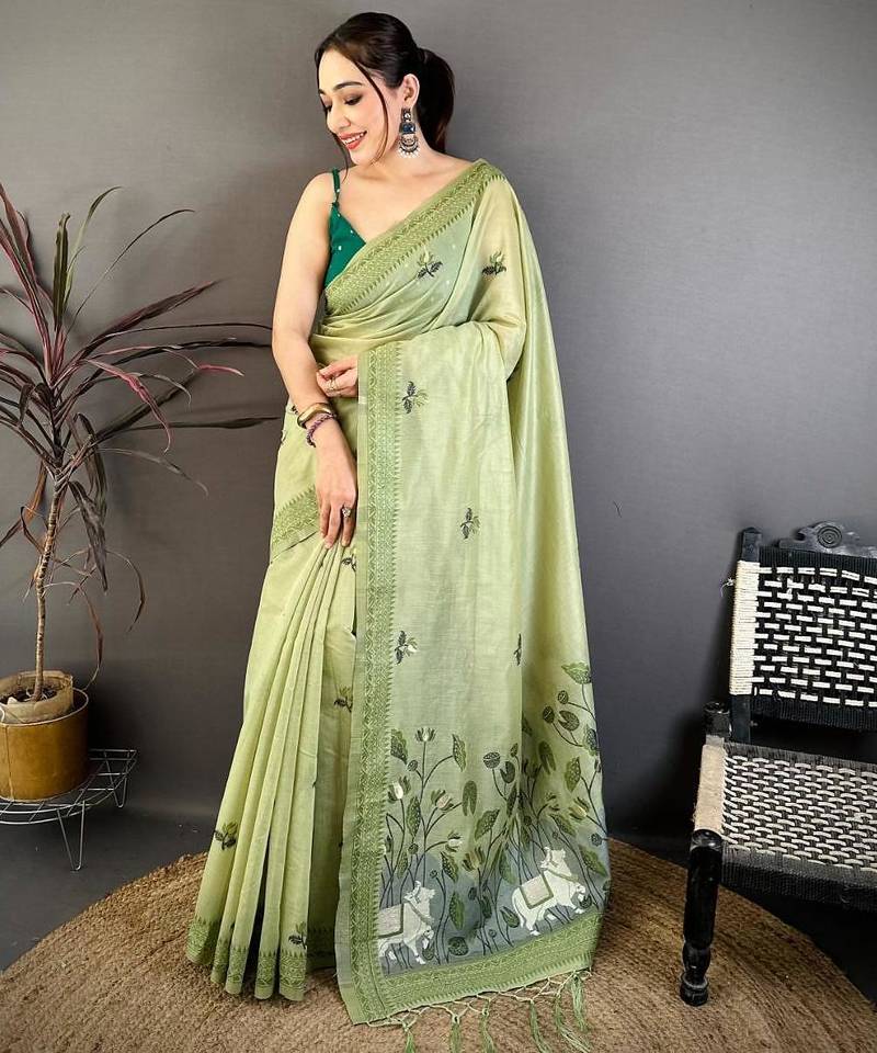 green color muga cotton blend woven with flower printed saree