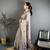 grey color muga cotton blend woven with flower printed saree