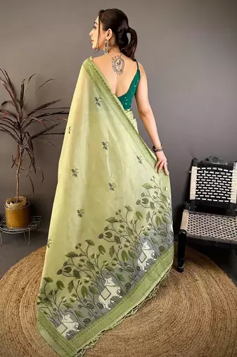 green color muga cotton blend woven with flower printed saree