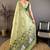 green color muga cotton blend woven with flower printed saree