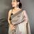 grey color muga cotton blend woven with flower printed saree