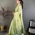 green color muga cotton blend woven with flower printed saree