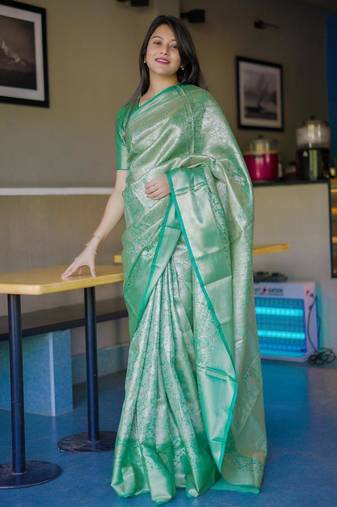 green color kanchipuram silk blend zari weaving saree with blouse piece