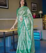 green color kanchipuram silk blend zari weaving saree with blouse piece