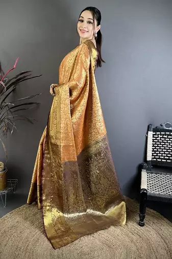 orange color kanjivaram silk blend flower zari woven saree with blouse