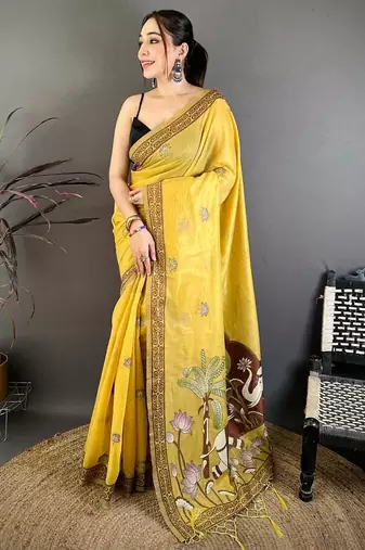 yellow color muga cotton blend woven motif saree with blouse