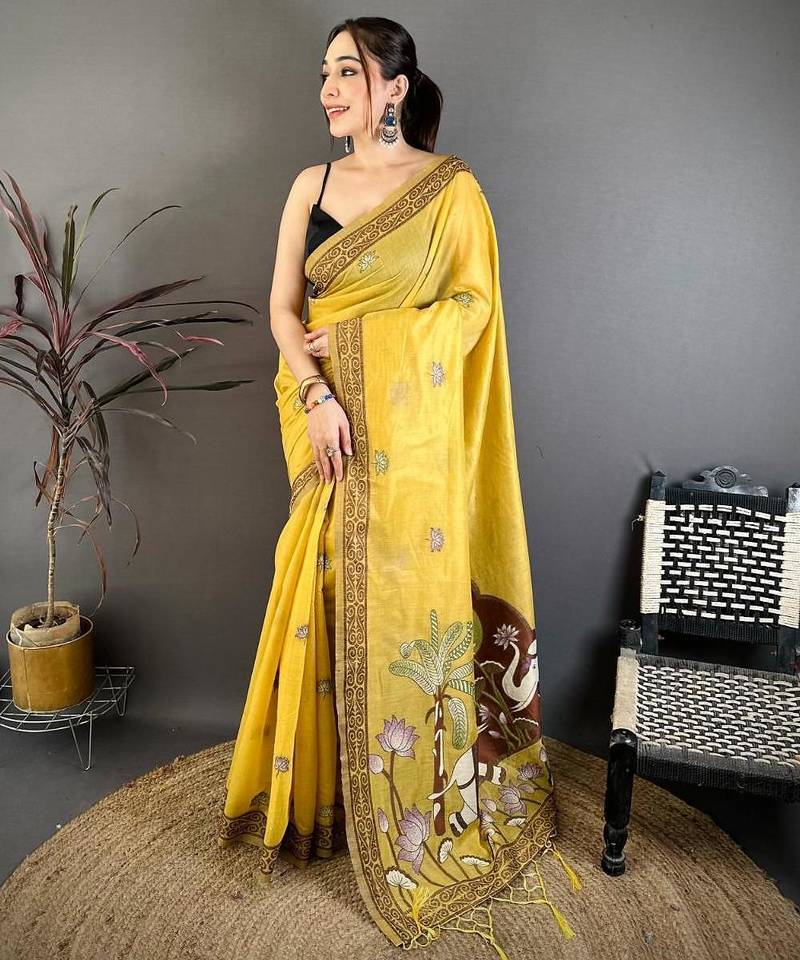 yellow color muga cotton blend woven motif saree with blouse
