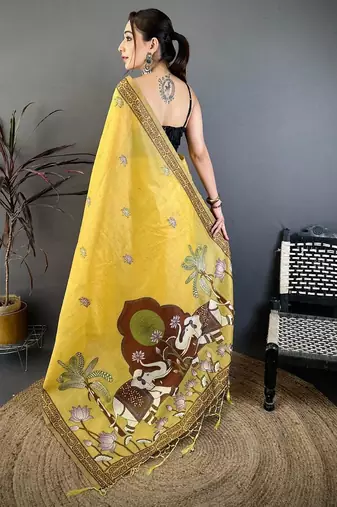 yellow color muga cotton blend woven motif saree with blouse