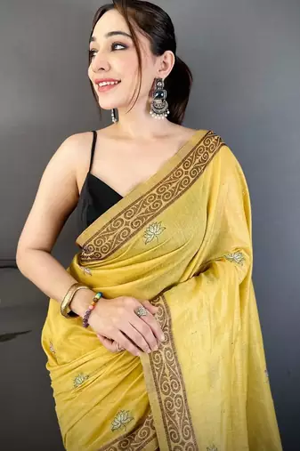 yellow color muga cotton blend woven motif saree with blouse