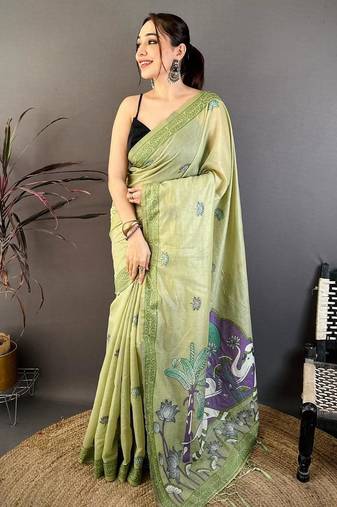 green color muga cotton blend woven motif saree with blouse