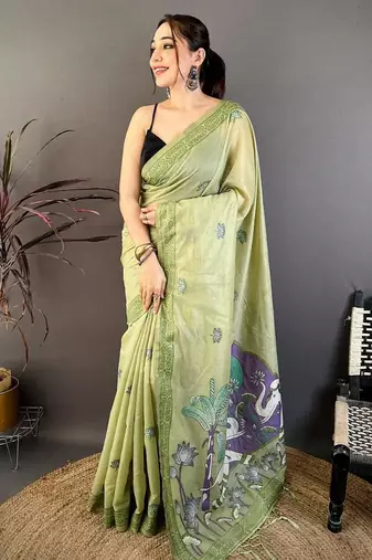green color muga cotton blend woven motif saree with blouse