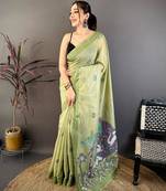 green color muga cotton blend woven motif saree with blouse