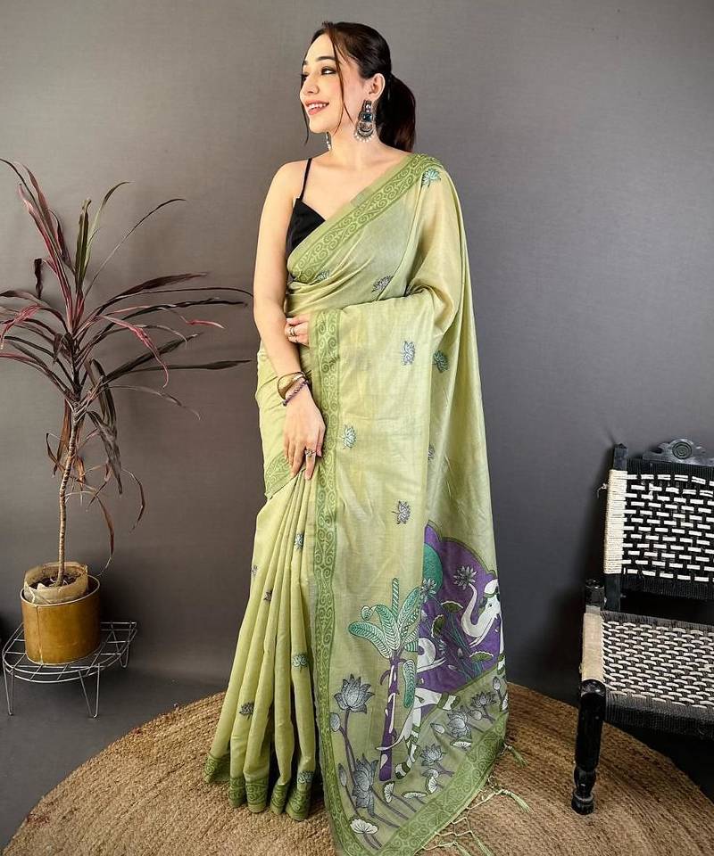 green color muga cotton blend woven motif saree with blouse