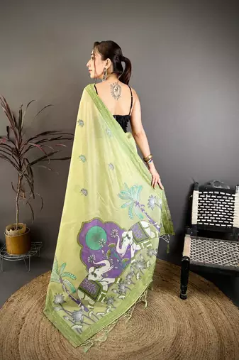green color muga cotton blend woven motif saree with blouse