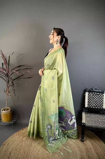 green color muga cotton blend woven motif saree with blouse