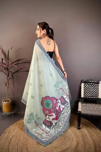 sky blue color muga cotton blend woven motif saree with blouse