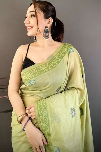 green color muga cotton blend woven motif saree with blouse