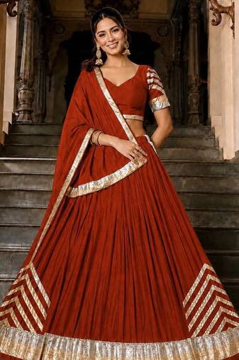 Navratri Orange Silk Blend Plain Lehenga Choli