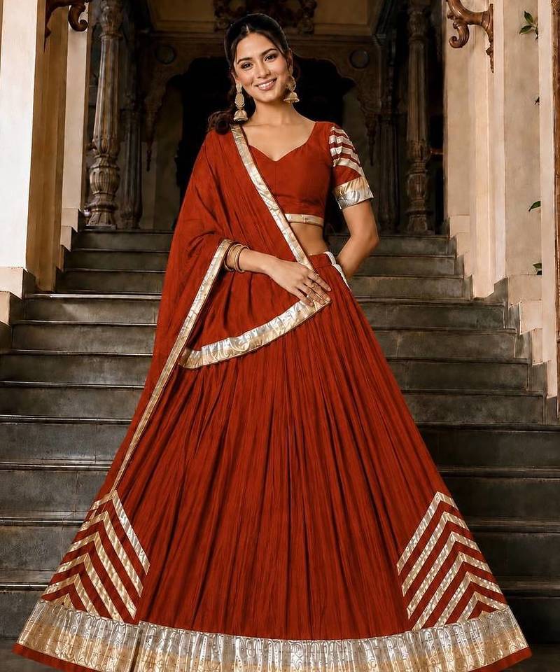 Navratri Orange Silk Blend Plain Lehenga Choli