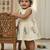 Cream south indian traditional pattu pavadai tapeta silk embrodairy frock dress
