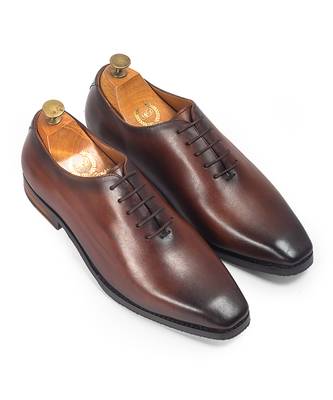 Tan brown leather wholecut shoes 1