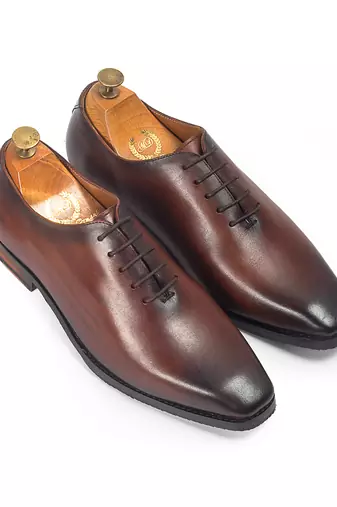 Tan brown leather wholecut shoes