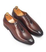 Tan brown leather wholecut shoes