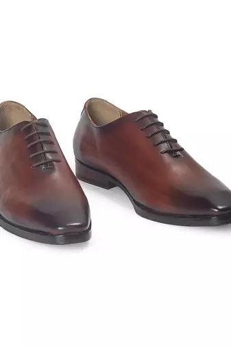 Tan brown leather wholecut shoes