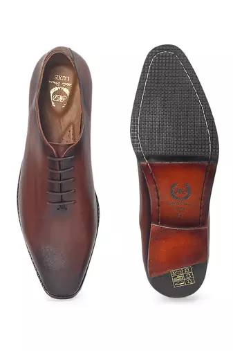 Tan brown leather wholecut shoes
