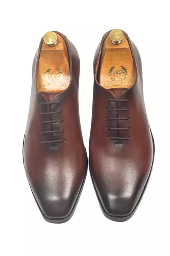 Tan brown leather wholecut shoes